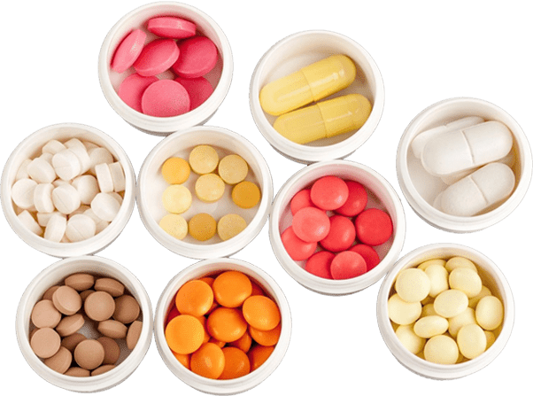 A group of bowls filled with different types of candy.